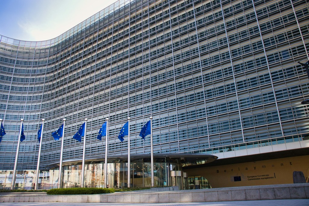 The Berlaymont building of the European Commission in Brussels with European Union flags